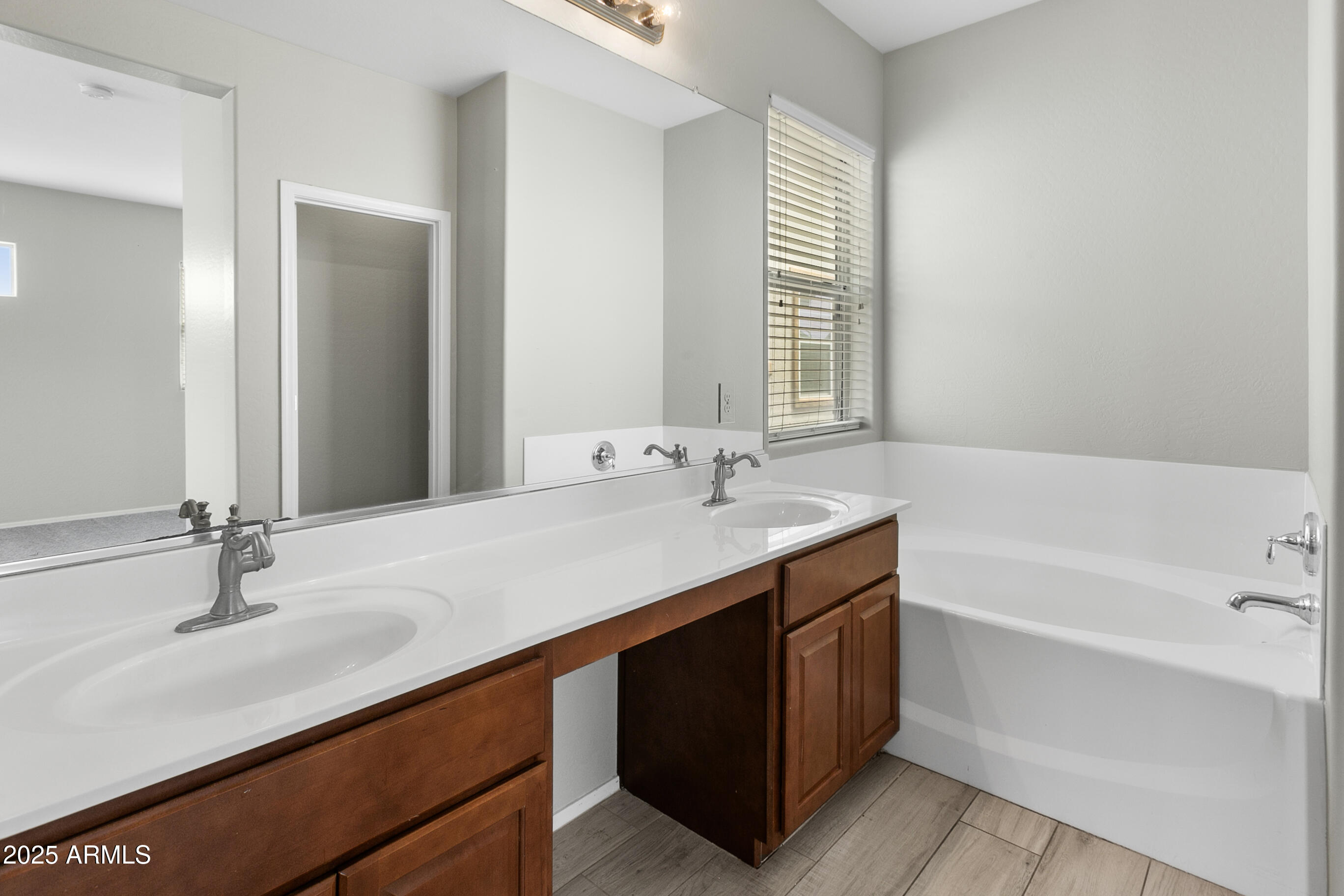 9124 South Roberts Road Tempe, AZ 85284 - Photo 22 of 27 a bathroom with a sink double vanity and a bathtub