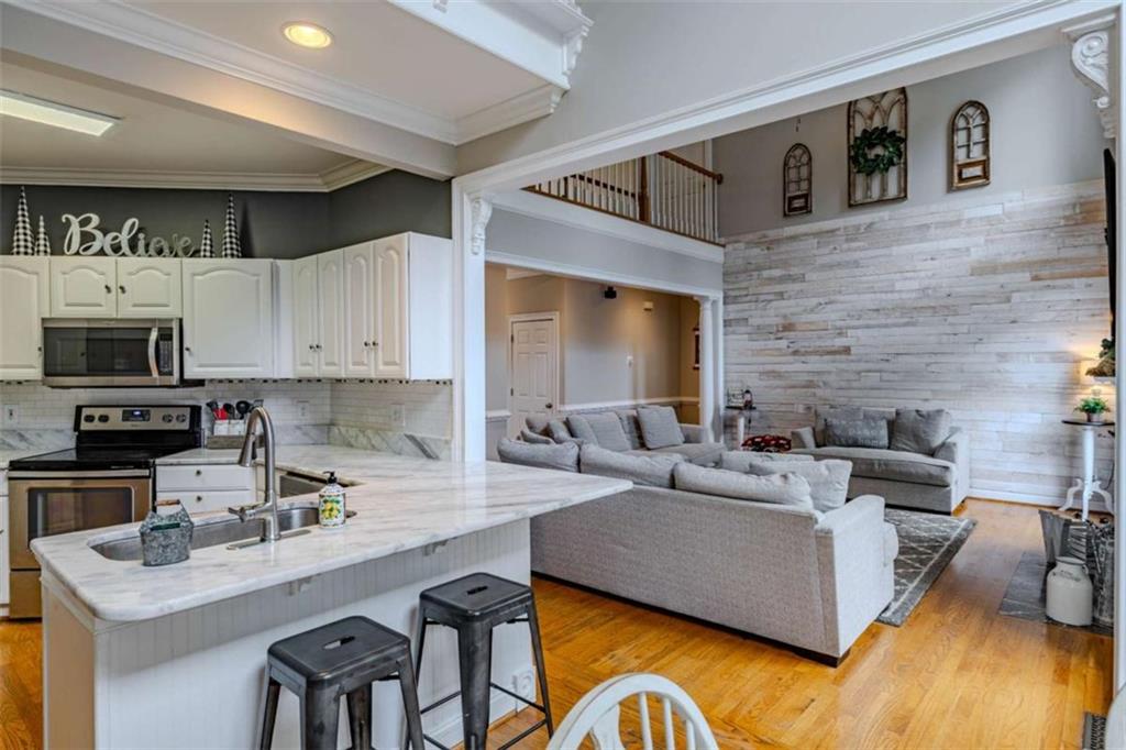 26 Saddlebrook Drive Rome, GA 30161 - Photo 15 of 63 a living room with fireplace furniture and a wooden floor