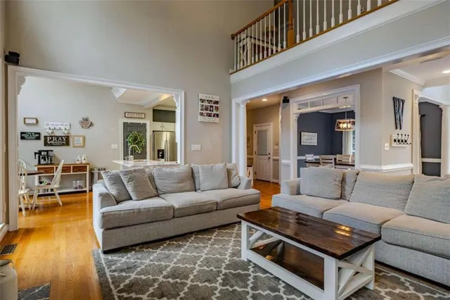 a kitchen with granite countertop a sink stainless steel appliances and cabinets