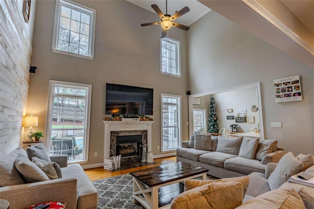 26 Saddlebrook Drive Rome, GA 30161 - Photo 19 of 63 a living room with furniture ceiling fan and a fireplace