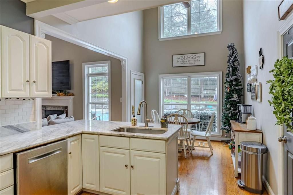 26 Saddlebrook Drive Rome, GA 30161 - Photo 21 of 63 a kitchen with stainless steel appliances granite countertop a stove a sink and a refrigerator