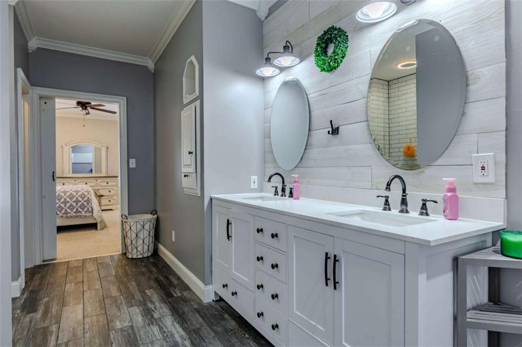 26 Saddlebrook Drive Rome, GA 30161 - Photo 26 of 63 a bathroom with a double vanity sink and a mirror