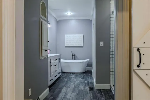 a bathroom with a granite countertop toilet and a sink