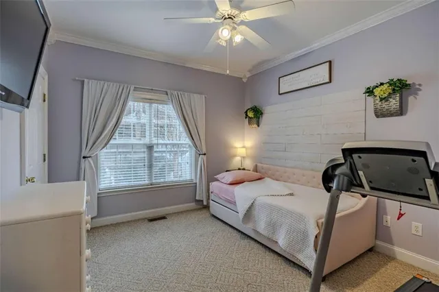 a room with a bed and a book shelf
