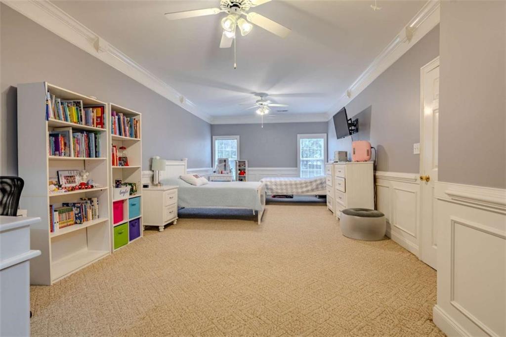 26 Saddlebrook Drive Rome, GA 30161 - Photo 36 of 63 a living room with furniture and a book shelf