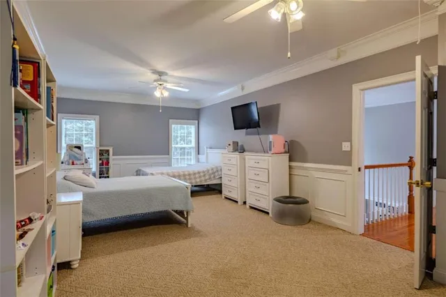 a room with furniture and a flat screen tv