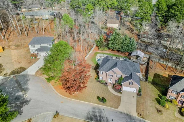 an aerial view of residential houses with outdoor space