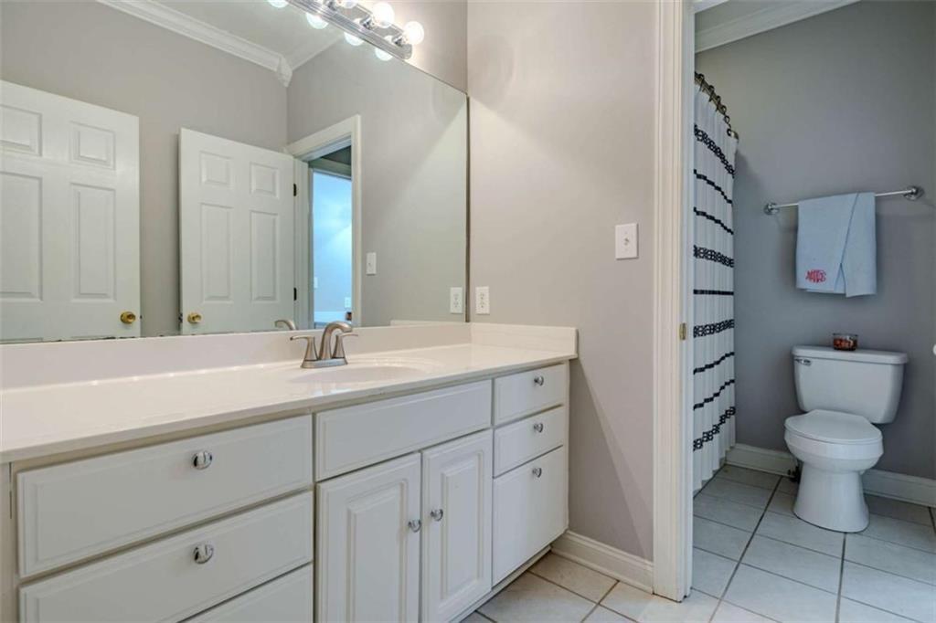 26 Saddlebrook Drive Rome, GA 30161 - Photo 52 of 63 a bathroom with a toilet sink and mirror