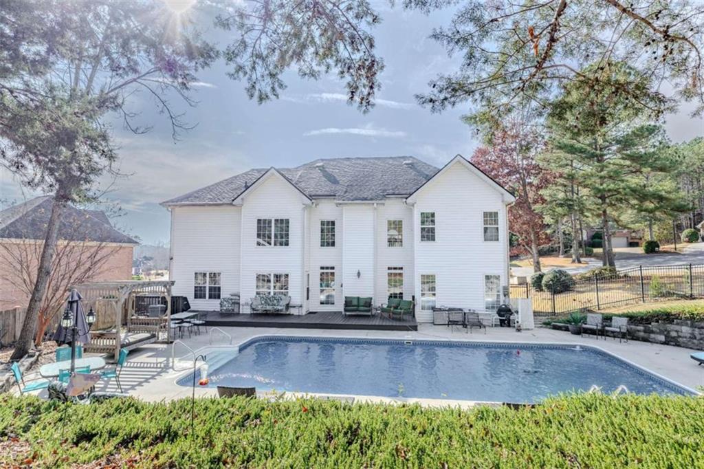 26 Saddlebrook Drive Rome, GA 30161 - Photo 56 of 63 a view of a white house with a swimming pool and sitting area