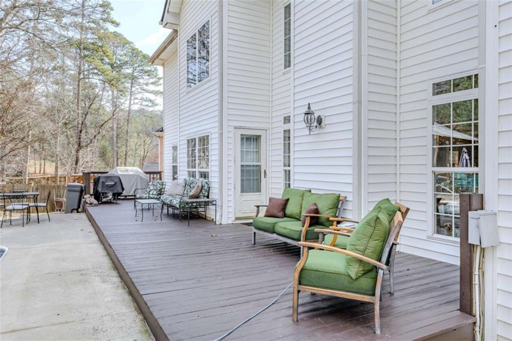 26 Saddlebrook Drive Rome, GA 30161 - Photo 62 of 63 a view of a patio with couches and a potted plant on a table