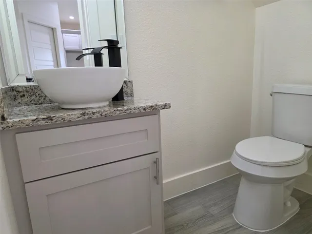 a view of bathroom with a toilet and a sink