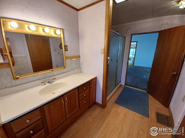 a bathroom with a sink a mirror and a vanity