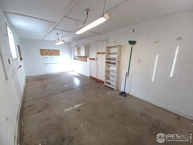 a view of a hallway with stairs