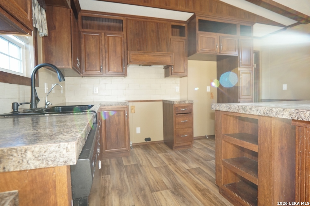 625 Pr 1517 Bandera, TX 78003 - Photo 17 of 18 a kitchen with granite countertop a sink and a stove