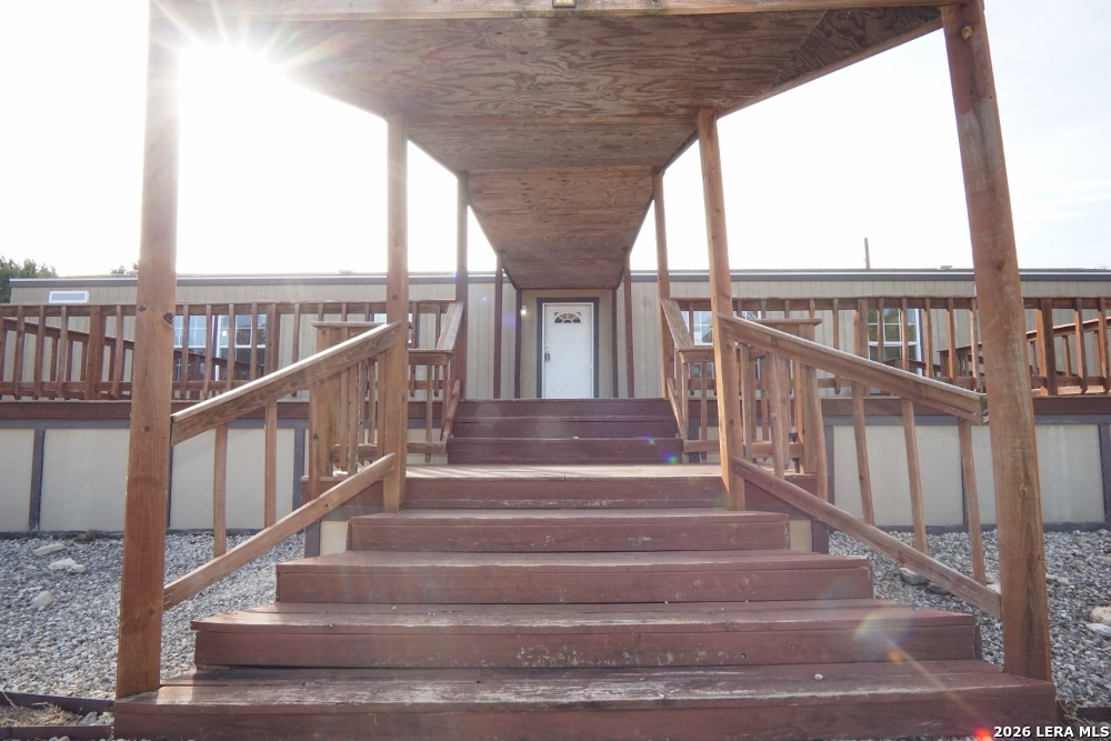 625 Pr 1517 Bandera, TX 78003 - Photo 3 of 18 a view of staircase with two large windows and a table
