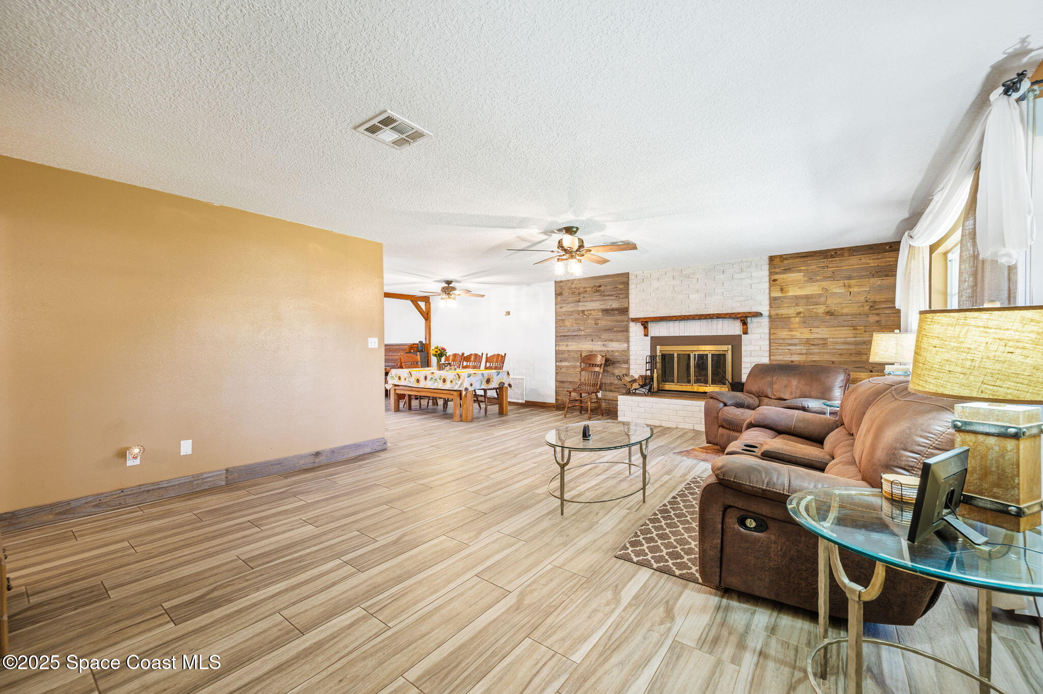 4505 Eldorado Way Melbourne, FL 32934 - Photo 15 of 78 a living room with furniture and a wooden floor