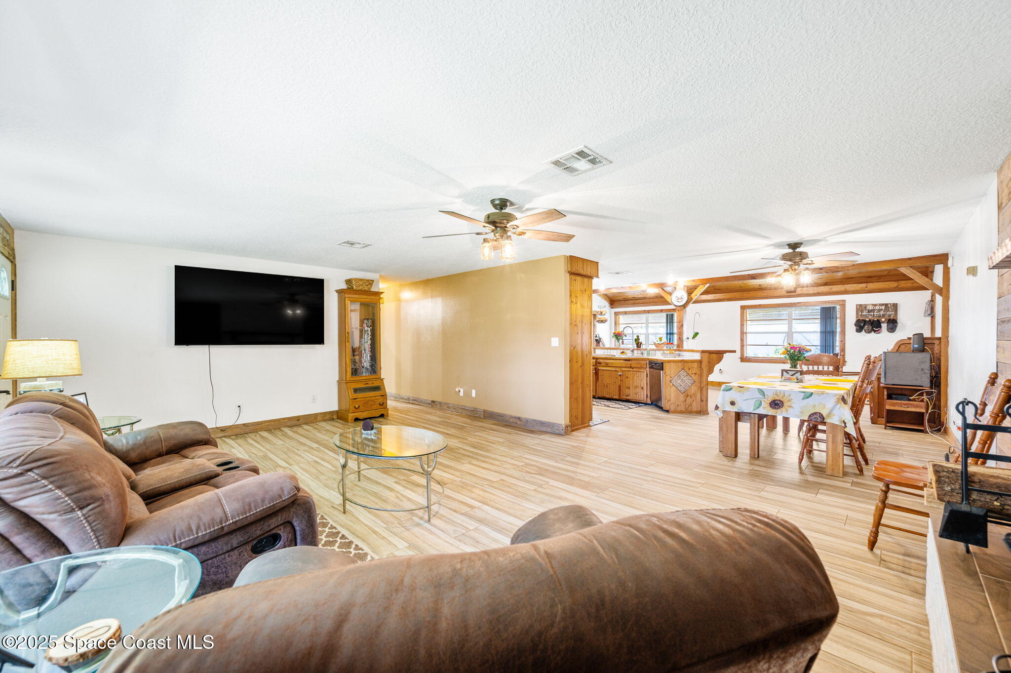 4505 Eldorado Way Melbourne, FL 32934 - Photo 18 of 78 a living room with furniture and a flat screen tv