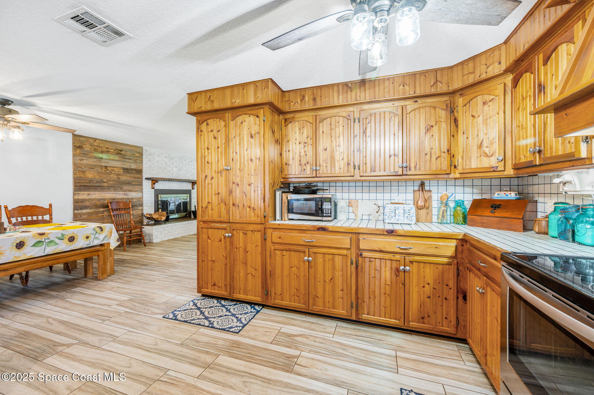 4505 Eldorado Way Melbourne, FL 32934 - Photo 23 of 78 a kitchen with stainless steel appliances granite countertop a stove and cabinets