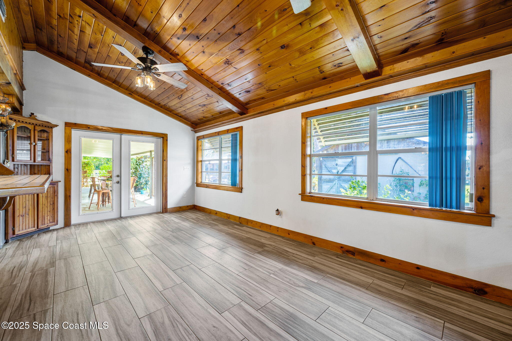 4505 Eldorado Way Melbourne, FL 32934 - Photo 25 of 78 a view of an empty room with wooden floor and a window