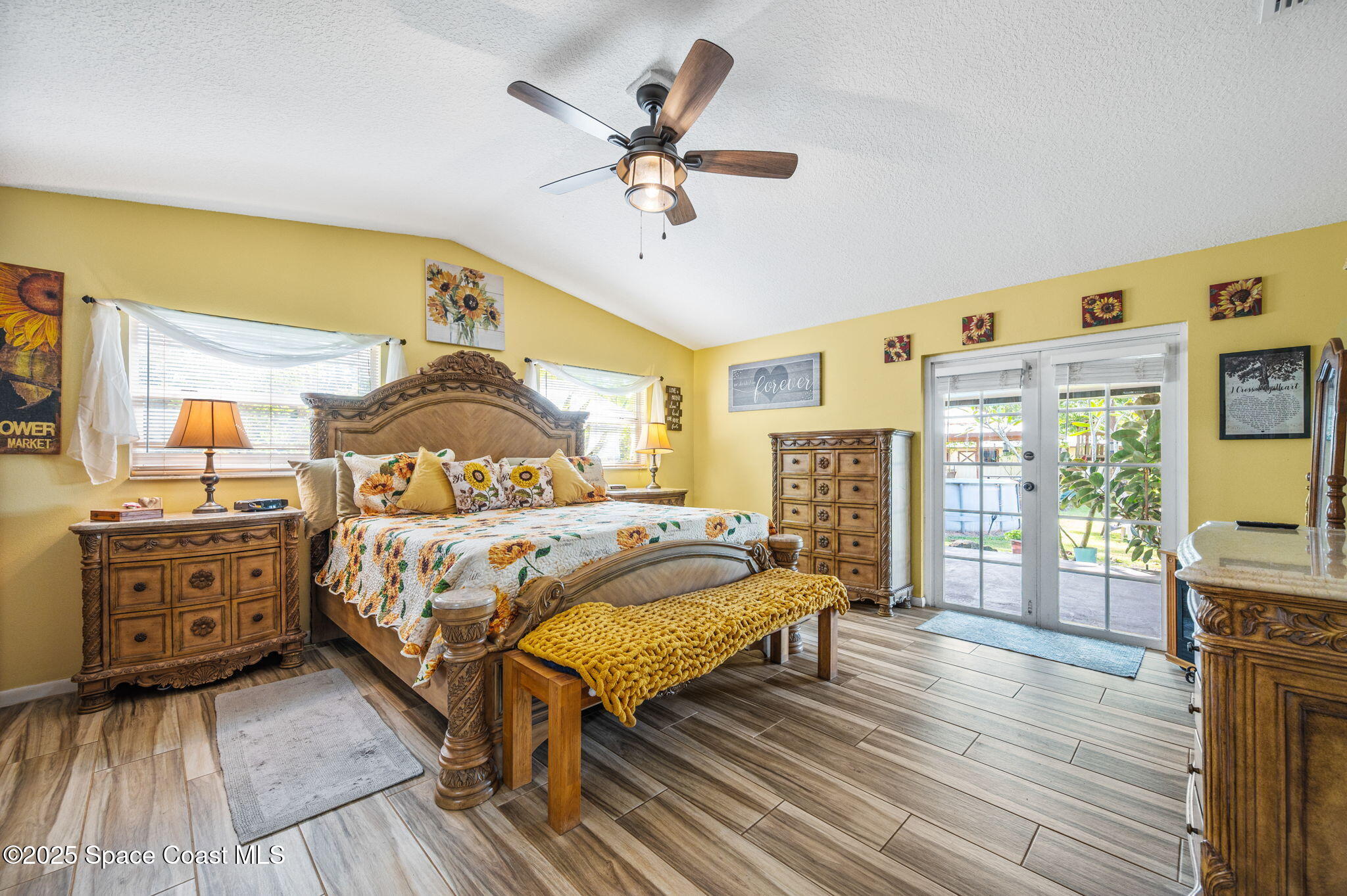 4505 Eldorado Way Melbourne, FL 32934 - Photo 28 of 78 a bedroom with a bed and wooden floor