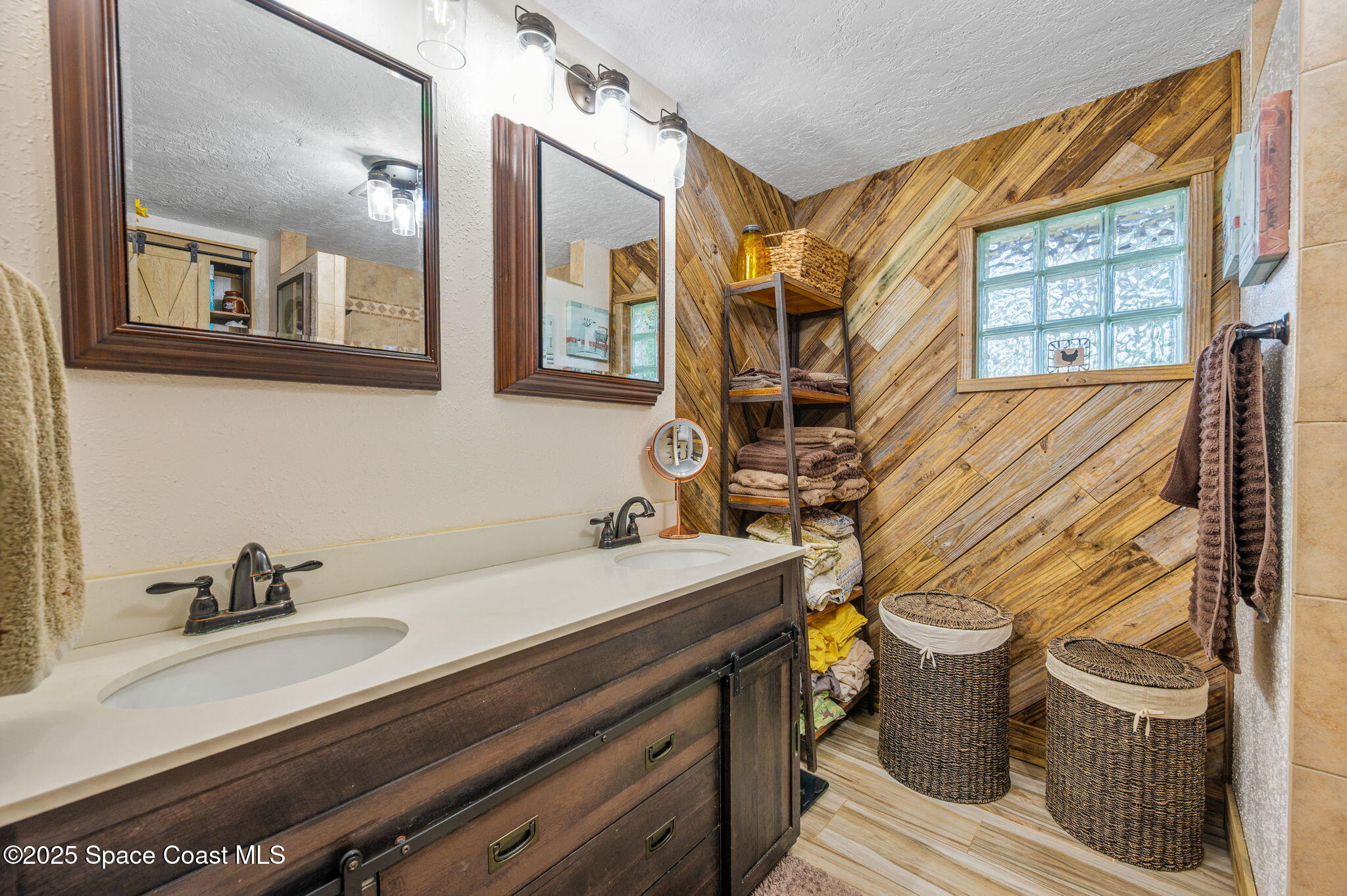 4505 Eldorado Way Melbourne, FL 32934 - Photo 32 of 78 a bathroom with a sink and a mirror