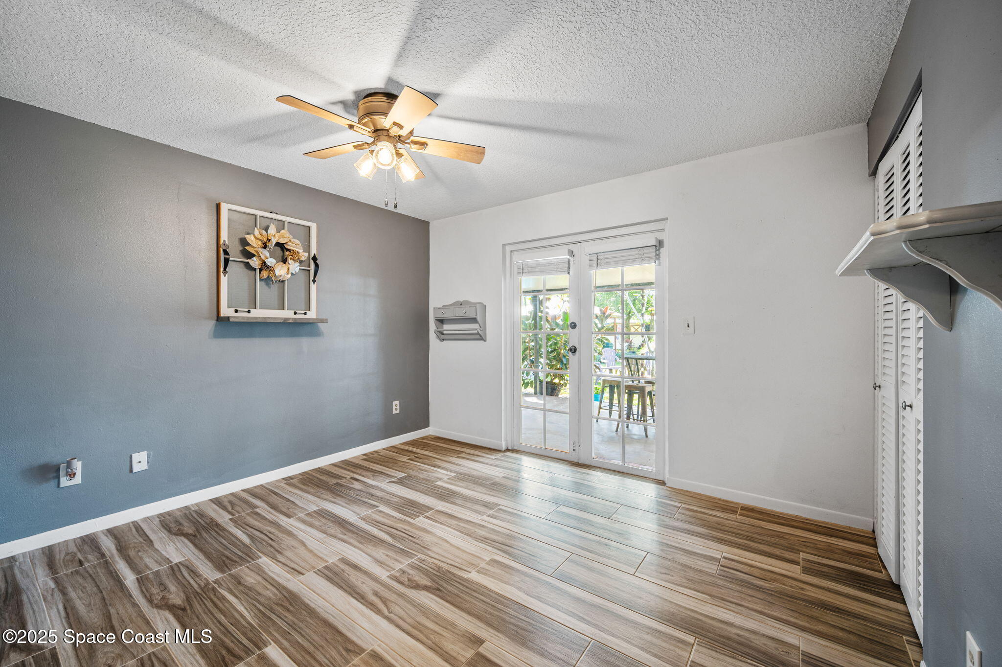 4505 Eldorado Way Melbourne, FL 32934 - Photo 36 of 78 a view of an empty room with a window and wooden floor