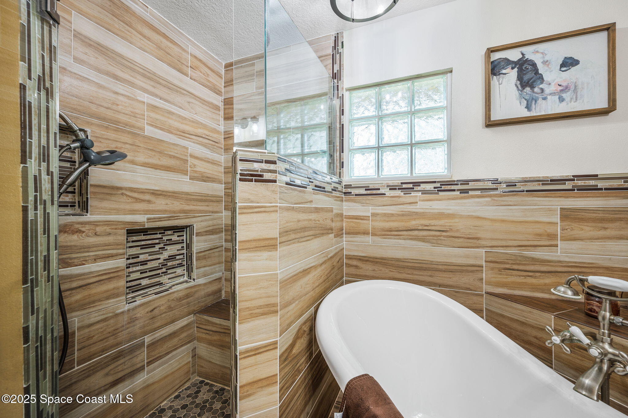 4505 Eldorado Way Melbourne, FL 32934 - Photo 39 of 78 a bathroom with a sink a mirror and shower