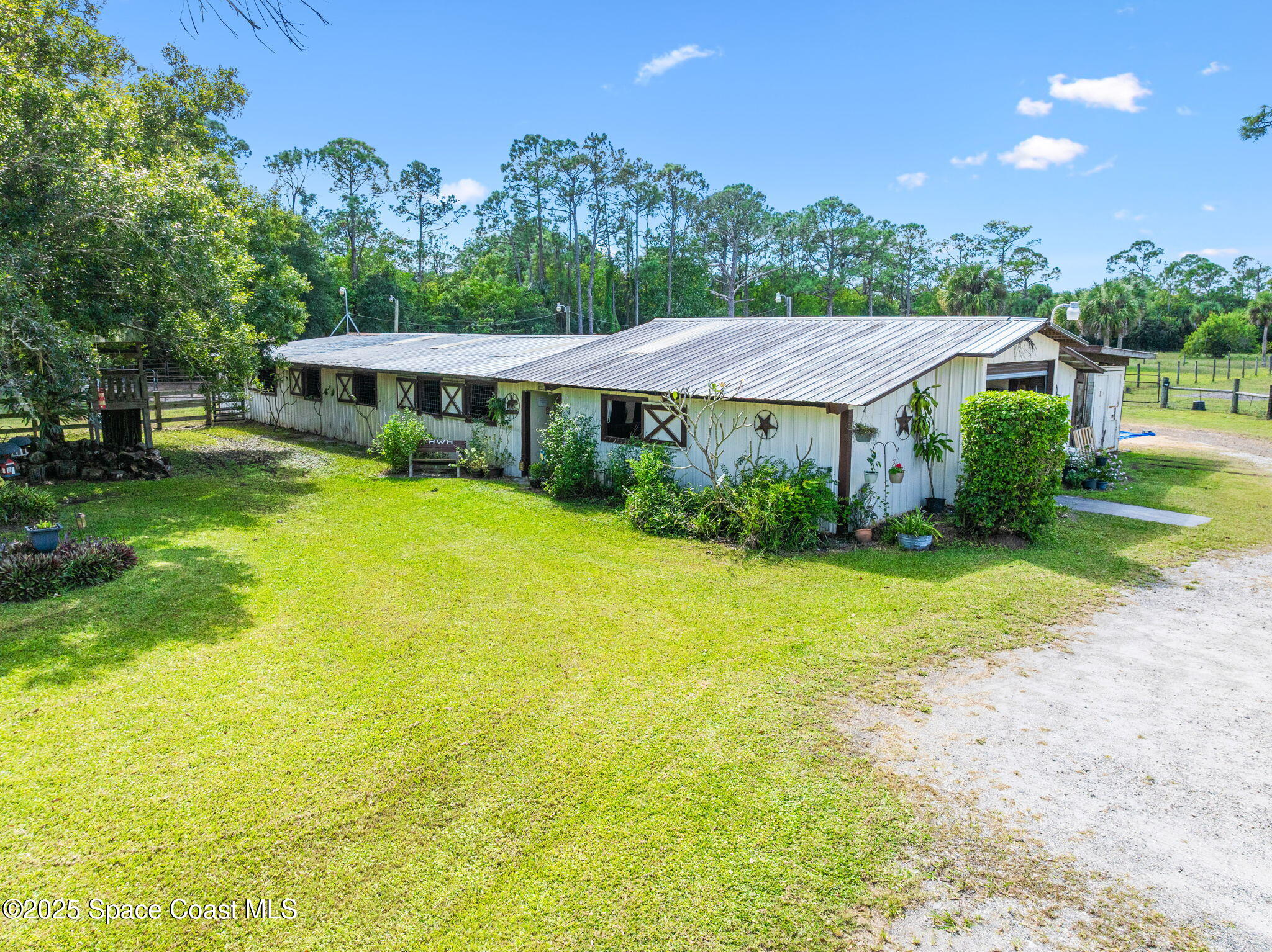 4505 Eldorado Way Melbourne, FL 32934 - Photo 4 of 78 a front view of a house with garden