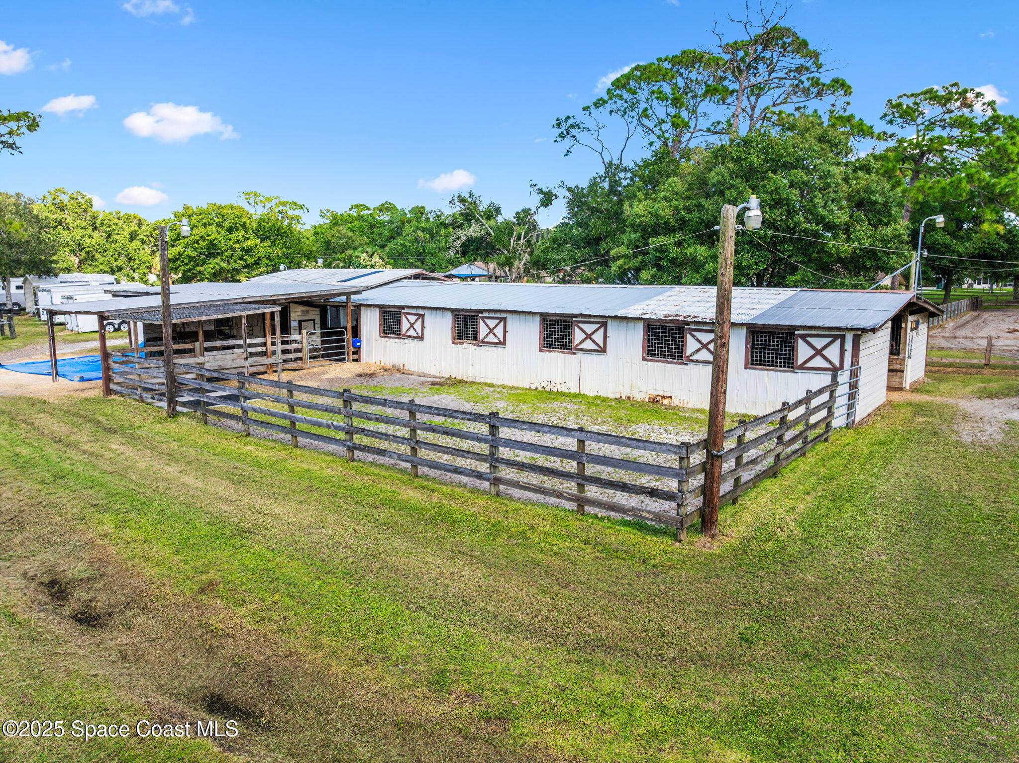 4505 Eldorado Way Melbourne, FL 32934 - Photo 5 of 78 a view of a house with a backyard and a patio