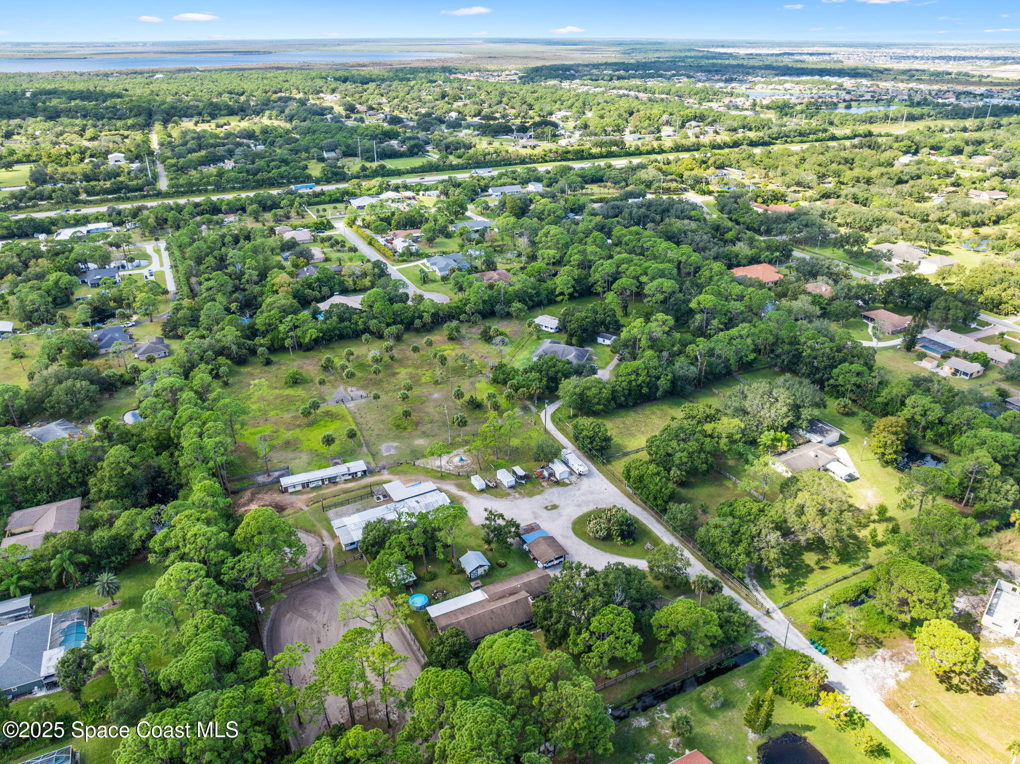 4505 Eldorado Way Melbourne, FL 32934 - Photo 59 of 78 an aerial view of residential houses with outdoor space and trees