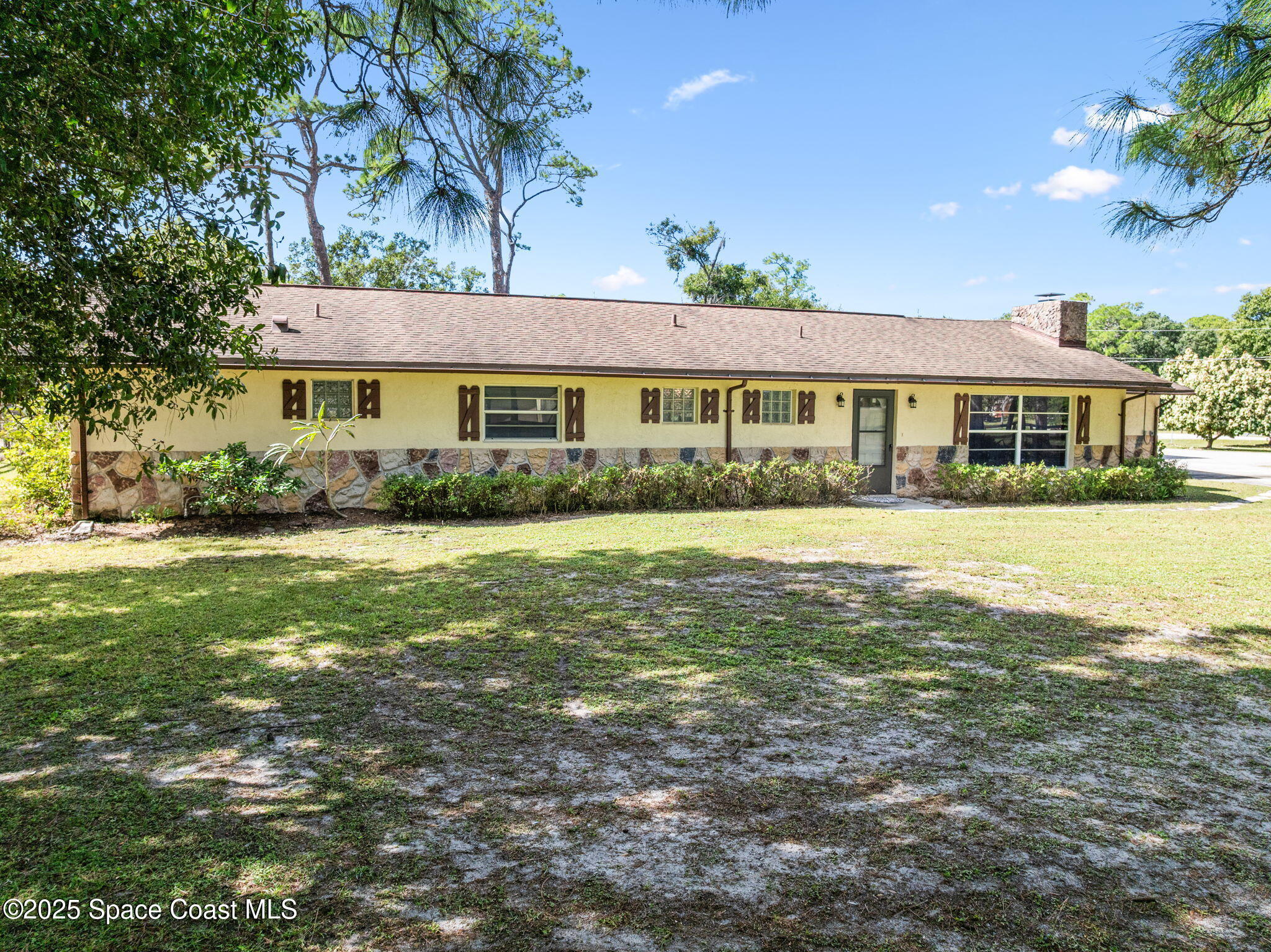 4505 Eldorado Way Melbourne, FL 32934 - Photo 74 of 78 a front view of a house with a yard