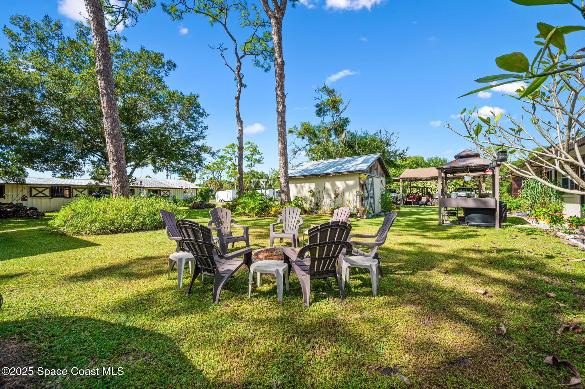 4505 Eldorado Way Melbourne, FL 32934 - Photo 9 of 78 a view of a chairs and table in the garden