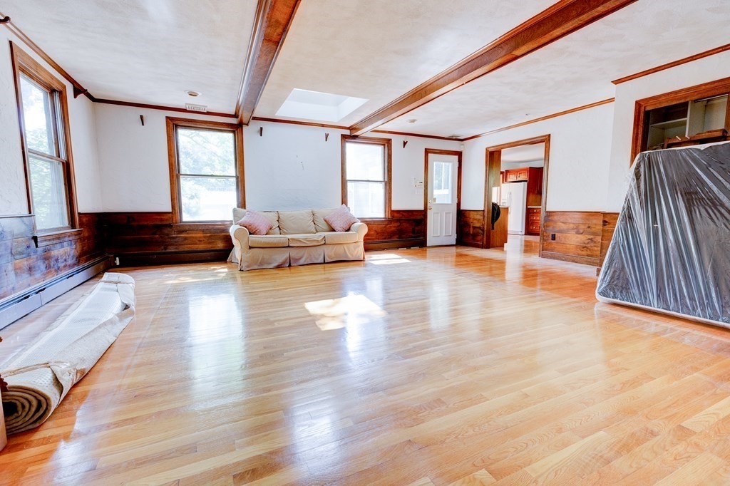 44 Colgate Road Needham, MA 02492 - Photo 13 of 30 a living room with furniture and a large window