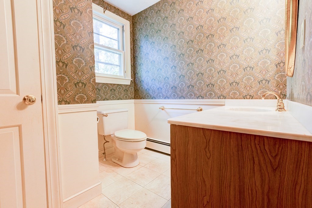 44 Colgate Road Needham, MA 02492 - Photo 14 of 30 a bathroom with a toilet a sink and a window