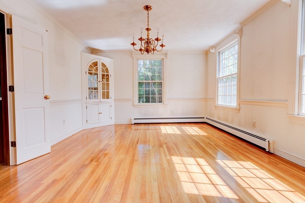 44 Colgate Road Needham, MA 02492 - Photo 8 of 30 a view of an empty room with wooden floor and a window