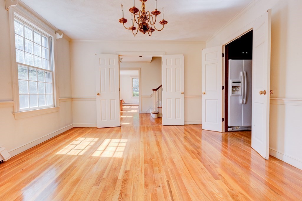 44 Colgate Road Needham, MA 02492 - Photo 9 of 30 a view of an empty room with wooden floor and a window