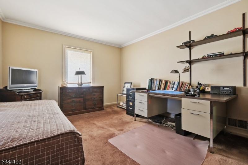 20 Kew Drive Springfield, NJ 07081 - Photo 11 of 19 a bedroom with a bed and a desk