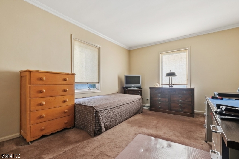 20 Kew Drive Springfield, NJ 07081 - Photo 13 of 19 a bedroom with a bed and a dresser
