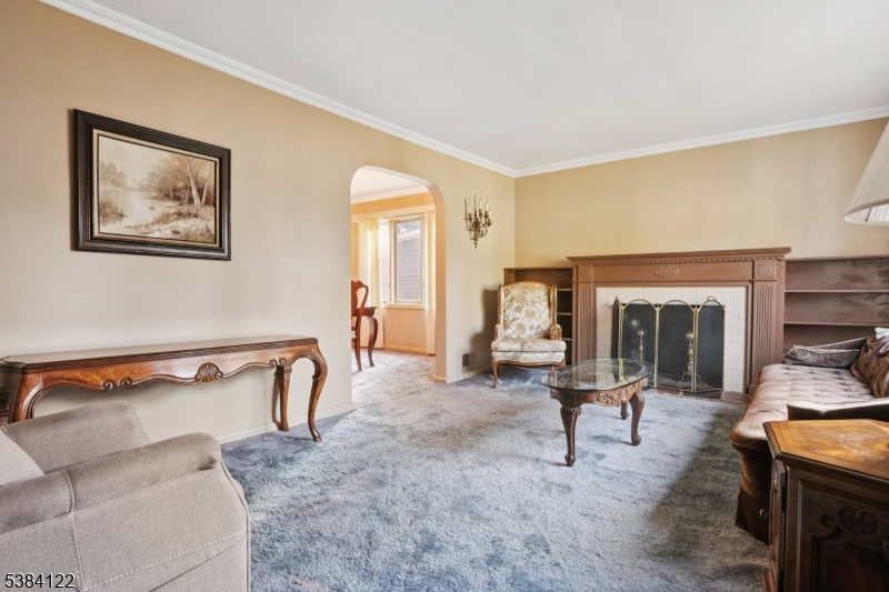 20 Kew Drive Springfield, NJ 07081 - Photo 4 of 19 a living room with furniture and a fireplace