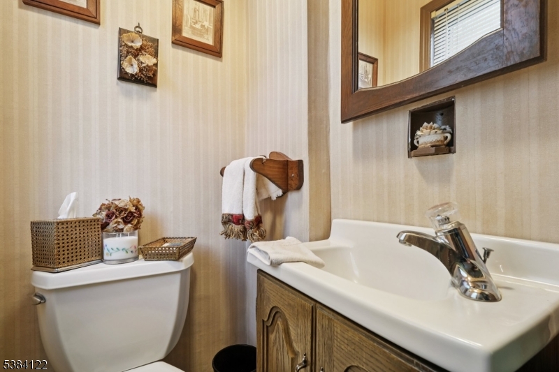 20 Kew Drive Springfield, NJ 07081 - Photo 9 of 19 a bathroom with a sink and a mirror