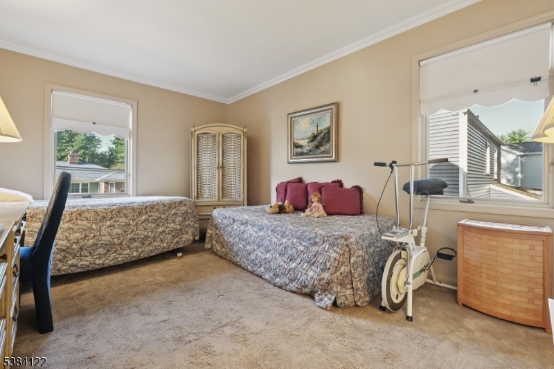 20 Kew Drive Springfield, NJ 07081 - Photo 10 of 19 a bedroom with a bed and a couch