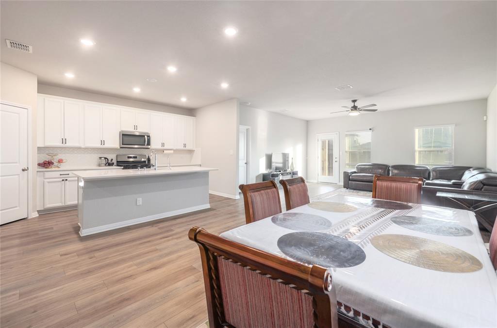 2815 Haystack Lane Round Rock, TX 78665 - Photo 11 of 30 Dining area with light wood-type flooring, recessed lighting, and a ceiling fan