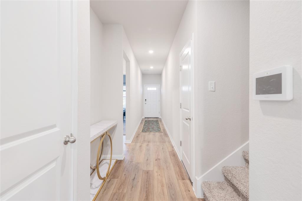 2815 Haystack Lane Round Rock, TX 78665 - Photo 16 of 30 Hallway with light wood-type flooring, recessed lighting, and stairs