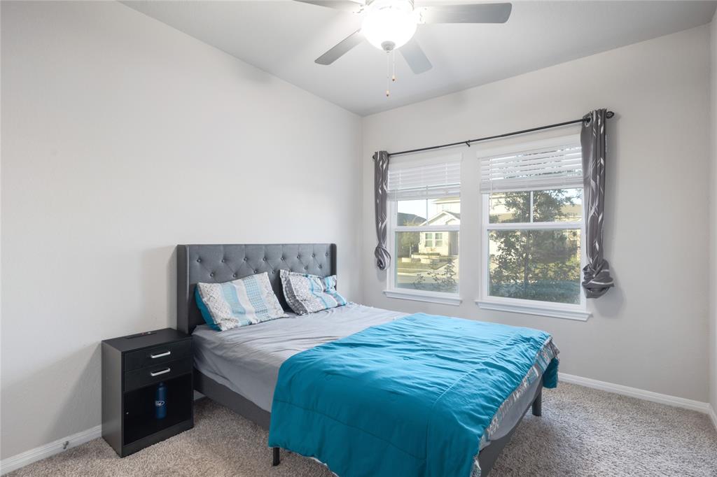 2815 Haystack Lane Round Rock, TX 78665 - Photo 21 of 30 Bedroom featuring carpet flooring and a ceiling fan