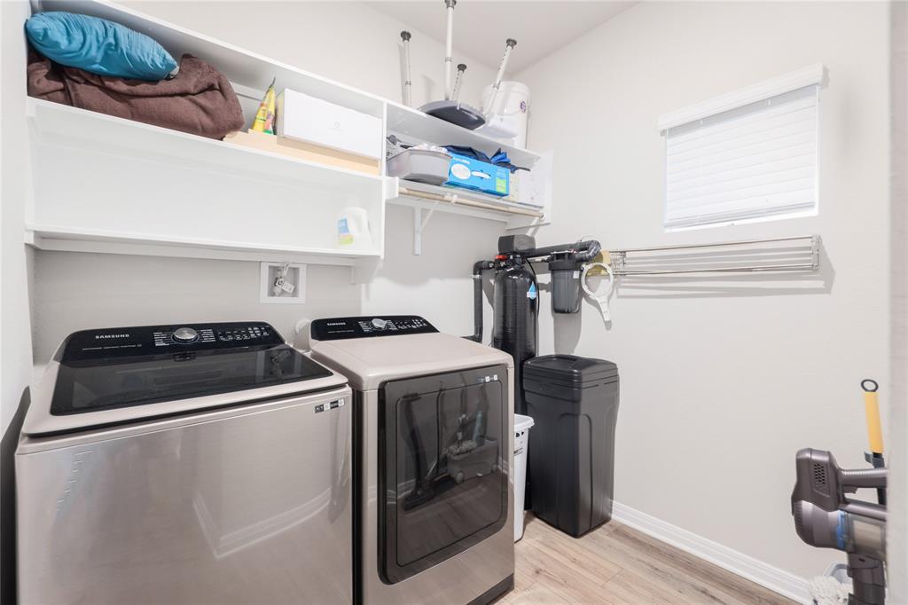 2815 Haystack Lane Round Rock, TX 78665 - Photo 26 of 30 Laundry room with light wood-style floors and separate washer and dryer