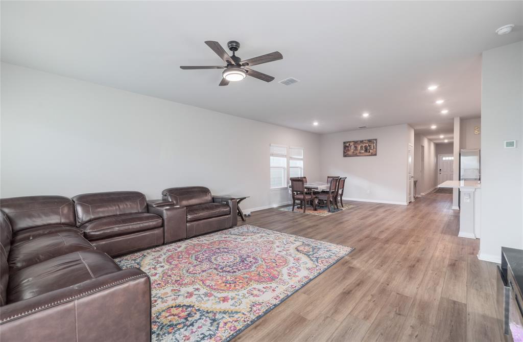 2815 Haystack Lane Round Rock, TX 78665 - Photo 8 of 30 Living area featuring light wood finished floors, recessed lighting, and ceiling fan