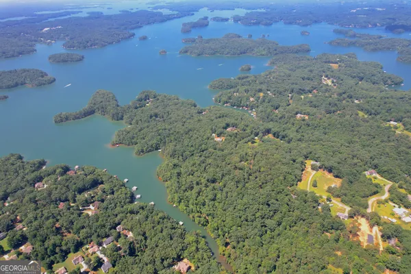 an aerial view of a house with a yard