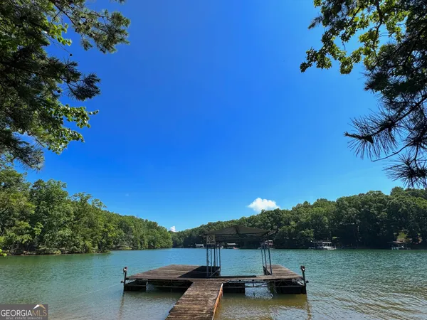 a view of a lake with beach and city view