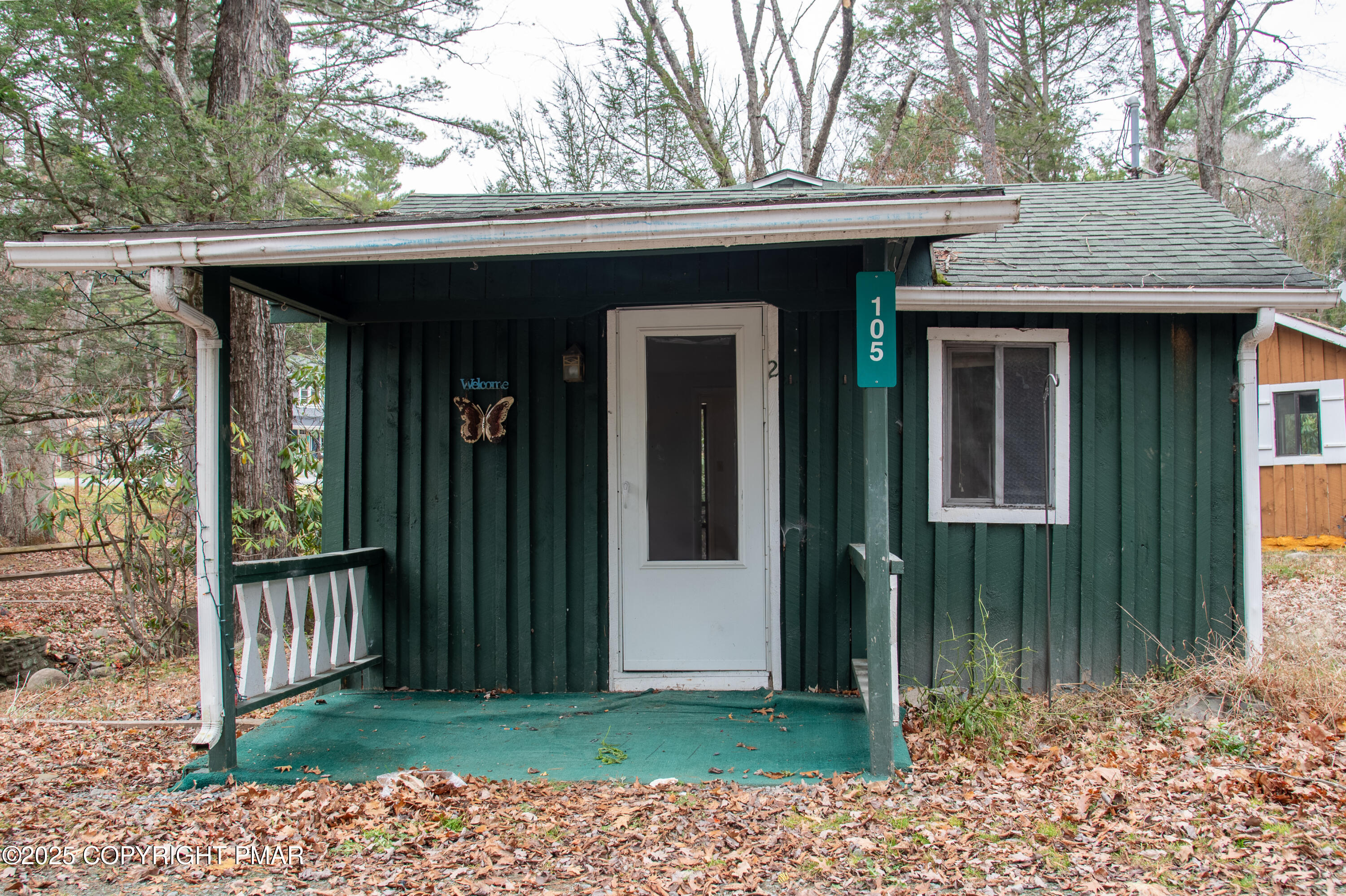 111 Rippling Brook Road Canadensis, PA 18325 - Photo 3 of 50 a view of a house with a small yard and wooden fence