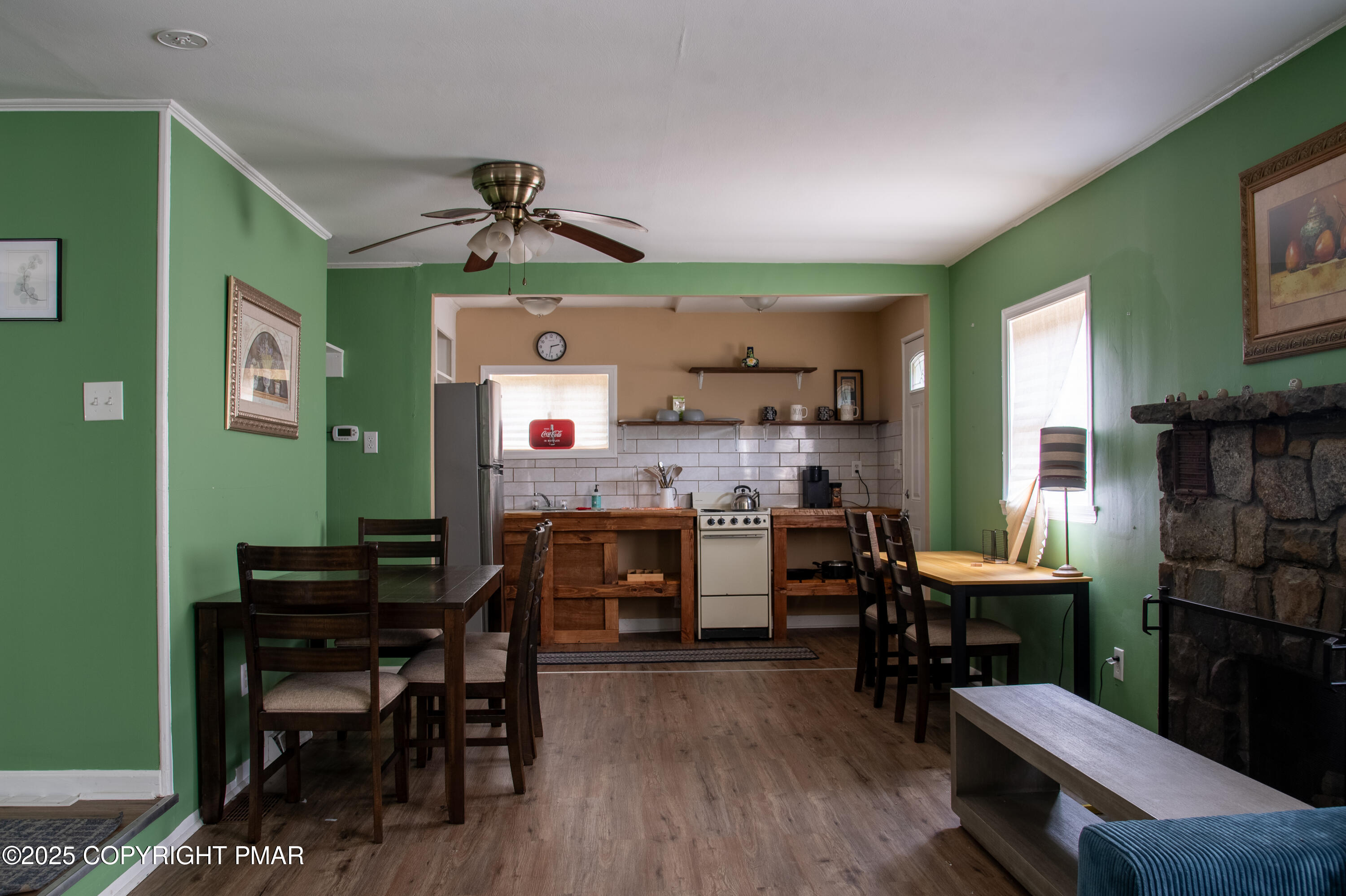 111 Rippling Brook Road Canadensis, PA 18325 - Photo 32 of 50 a view of a dining room with furniture and wooden floor